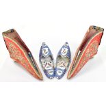 A pair of Chinese silk shoes with floral detail inside Greek key style border, length 11.5cm, with a