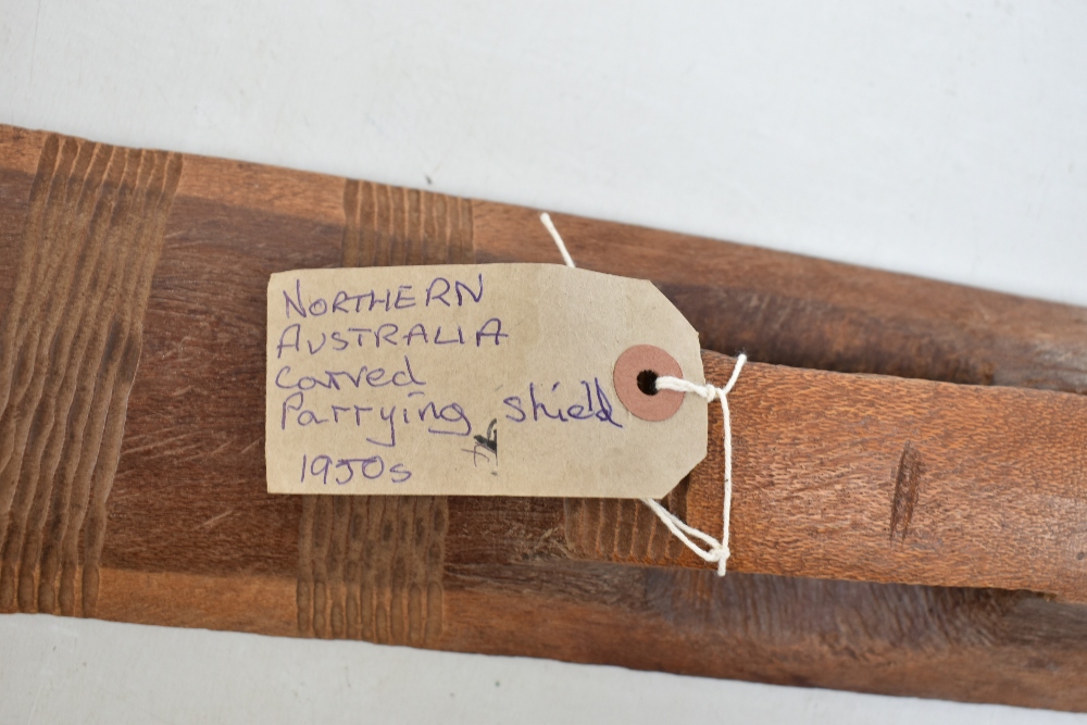 A mid-20th century Northern Australian parrying shield with bands of simple carved decoration, - Image 11 of 11