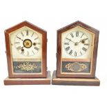 Two late 19th century German mantel clocks of arched form, both with circular dials set with Roman