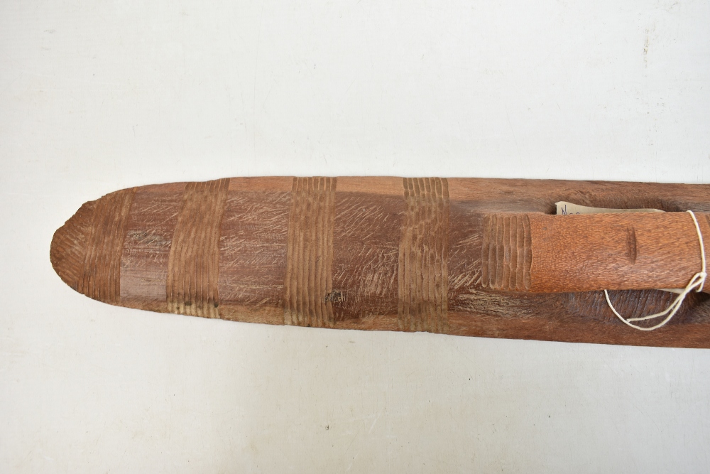 A mid-20th century Northern Australian parrying shield with bands of simple carved decoration, - Image 5 of 11