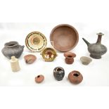 A Cretan black glazed ewer, a simple brown glazed bowl, a fish decorated bowl, etc.Additional