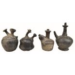 A group of four Attic ware ewers, two with simple bands of incised decoration, the largest 27cm.