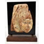 An Egyptian wooden fragment with traces of original painted decoration, 23 x 18cm, now mounted on