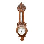 BOTLY & LEWIS OF READING; an early 20th century carved oak combination aneroid barometer and