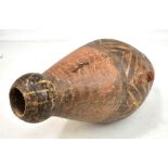 A circa 700BC Cretan terracotta amphora with fish scale incised decoration and central black painted