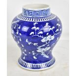 A late 19th/early 20th century Chinese baluster vase painted in underglaze blue with blossoming