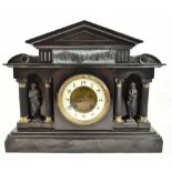 A D MOUGIN; a late 19th century French black slate mantel clock of architectural form featuring