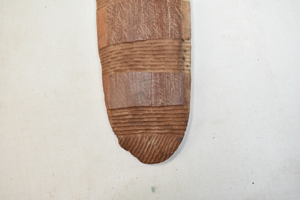 A mid-20th century Northern Australian parrying shield with bands of simple carved decoration, - Image 8 of 11