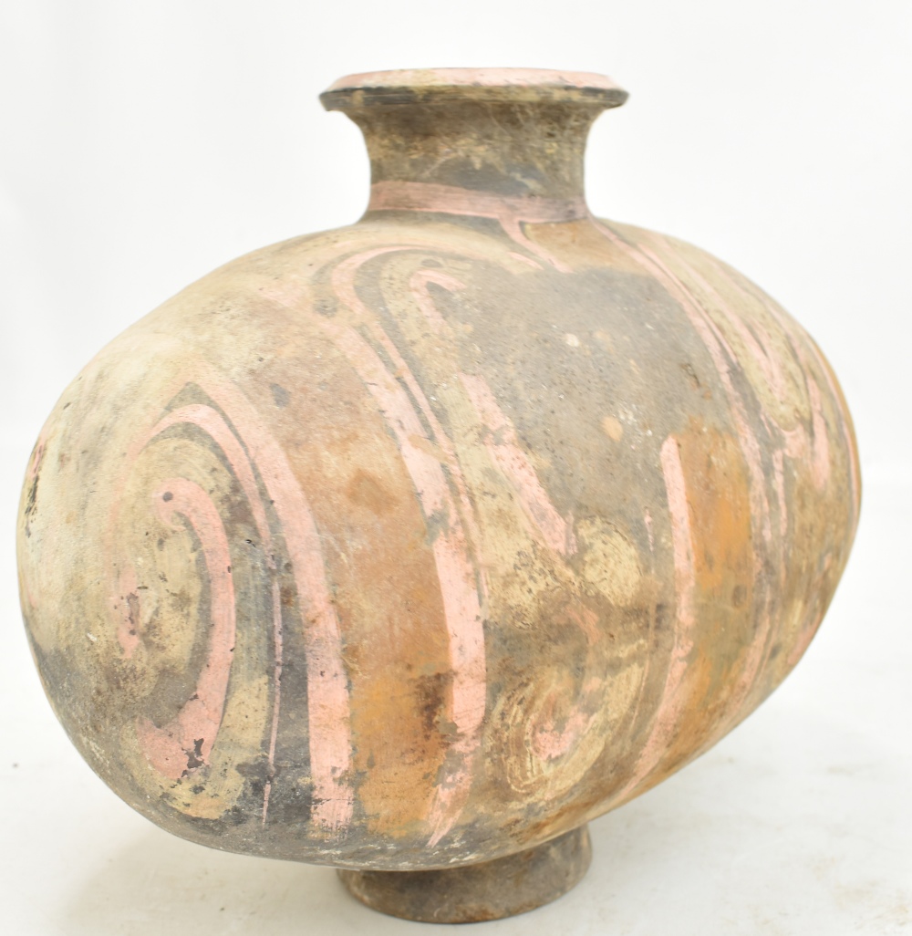 A Chinese Han dynasty earthenware cocoon vase with simple painted stylised detail on circular - Image 8 of 10