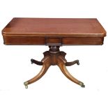 A William IV mahogany tea table with folding swivel top on turned column to four outswept legs