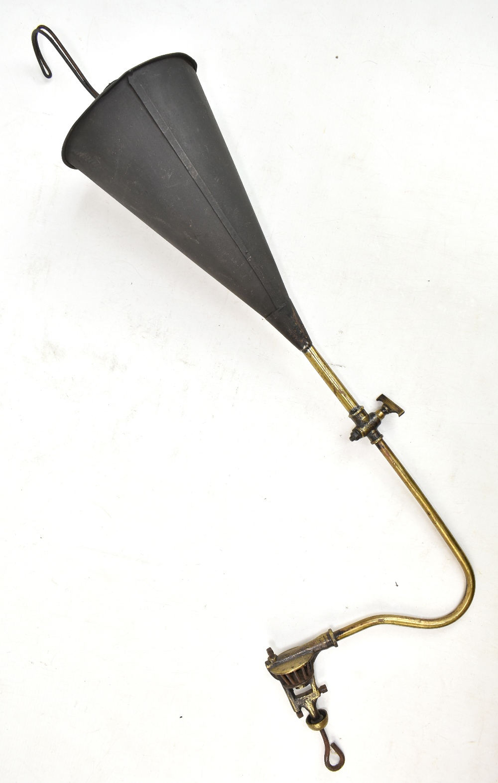 An open flame hanging lamp of a type used in some coal mines prior to the invention of safety lamps,