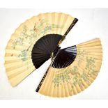Two late 19th/early 20th century lacquer and paper fans, both sets of outer sticks with gilt and