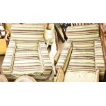 A pair of contemporary armchairs in striped fabric on block supports (2).