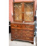 A George III mahogany secretaire bookcase, the later top section with twin astragal glazed doors,