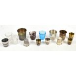 A collection of fourteen assorted thimble measuring cups to include slag glass example, height 6.
