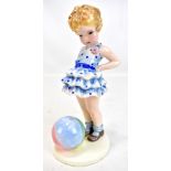 STEFAN DAKON FOR GOLDSCHEIDER; an Art Deco figurine of a girl beside a beach ball, impressed
