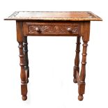 A reproduction carved oak side table with single frieze drawer raised on bun feet, height 69cm,