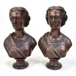 Two identical 20th century bronzed resin busts of Queen Alexandra, each raised on a socle base,