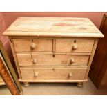 ***WITHDRAWN*** A late 19th century pine chest of two short over two long drawers on turned