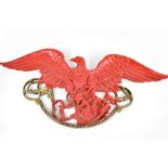 A red and gold painted cast metal pub sign modelled as an eagle on foliate scroll perch, approx 50 x
