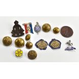 A collection of medals, badges and buttons, including The Bell medal, presented by The Society of