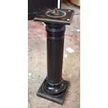 A late 19th/early 20th century ebonised column raised on plinth base, height 110cm, diameter 32cm.