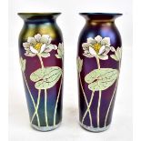 A pair of Art Nouveau overlaid iridescent glass vases, decorated with lilies, signed H4 with III (