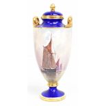 J E DEAN FOR MINTON; a hand painted twin handled pedestal urn decorated with sailing vessels in