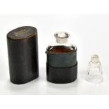 A 19th century leather cased railway companion flask with tot stopper, height 16cm.Additional