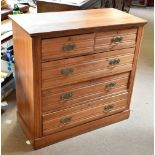 A late 19th century pine chest of two short over three long drawers with Art Nouveau brass