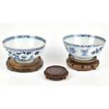A pair of 18th century Chinese export porcelain bowls painted in underglaze blue with trees and