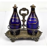 Two early/mid-19th century Bristol blue decanters with gilt 'Rum' and 'Brandy' detail, both with