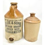 Two early 20th century stoneware flagons, the larger printed 'H.Lee & Sons Superior Draft Ginger