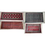 Four Middle Eastern hand knotted rugs, three red and one green ground, the largest 155 x 89cm (4).