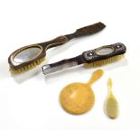 A George III horn combination hair brush, comb and mirror, length 11cm, a Victorian mother of