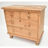 A late 19th/early 20th century pine chest of two short over two long drawers, height 83cm, length