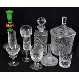A group of clear cut and moulded glass tableware including ice pail, five decanters including ship