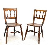 A set of eight ash and elm 19th century Gothic Thames Valley chairs with saddle seats and ring