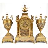 A D MOUGIN; a late 19th century French ormolu eight day gong strike mantel clock and garniture,