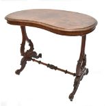 A Victorian rosewood kidney shaped side table on foliate carved stretchered supports to four