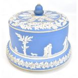 A 19th century pale blue jasper ware cheese dome and cover decorated with Grecian figures in
