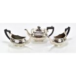 A pair of silver plated novelty wall pockets modelled in the form of half teapots with gadrooned