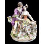 MEISSEN; a late 19th/early 20th century courting shepherd and shepherdess with sheep group, with