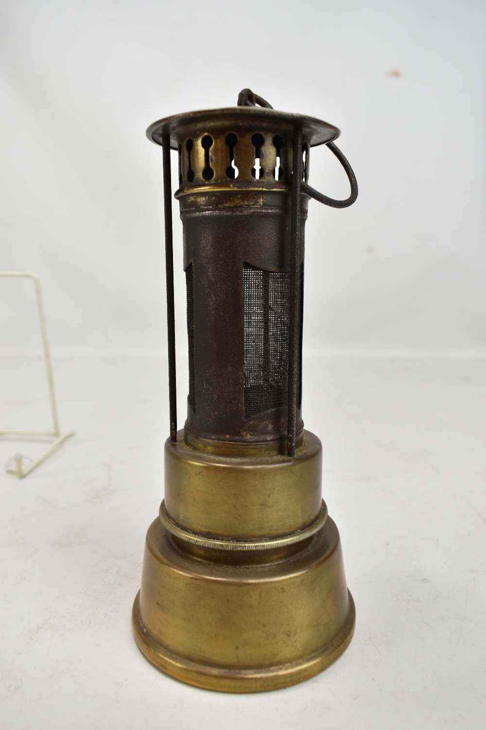 An early to mid 20th century brass safety heater with hook, height 22cm.Additional - Image 2 of 5