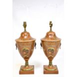 A pair of reproduction Sheraton Revival twin handled table lamps, both with oval panels featuring