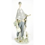 LLADRO; a figurine modelled in the form of a shepherd in naturalistic setting, complete with
