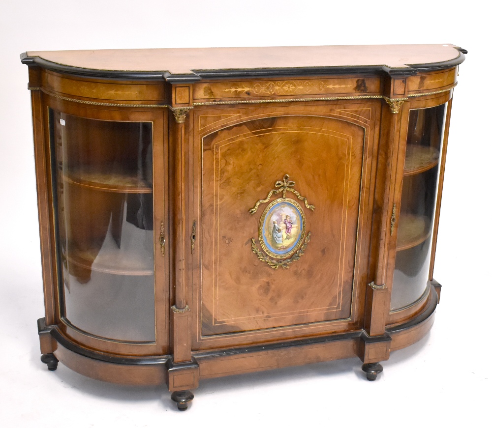 A Victorian burr walnut and inlaid credenza with gilt metal mounts and painted porcelain plaque to