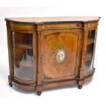 A Victorian burr walnut and inlaid credenza with gilt metal mounts and painted porcelain plaque to