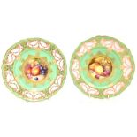 RICHARD SEABRIGHT FOR ROYAL WORCESTER; a pair of handpainted cabinet plates each with circular