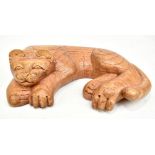 A carved wooden model of a sleeping cat, 29 x 20cm.Additional InformationGeneral surface wear,
